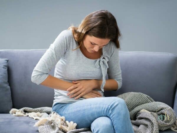 woman clutching stomach