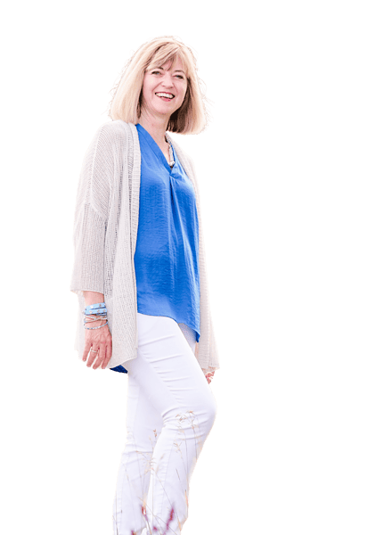 A woman in white pants and a blue cardigan.